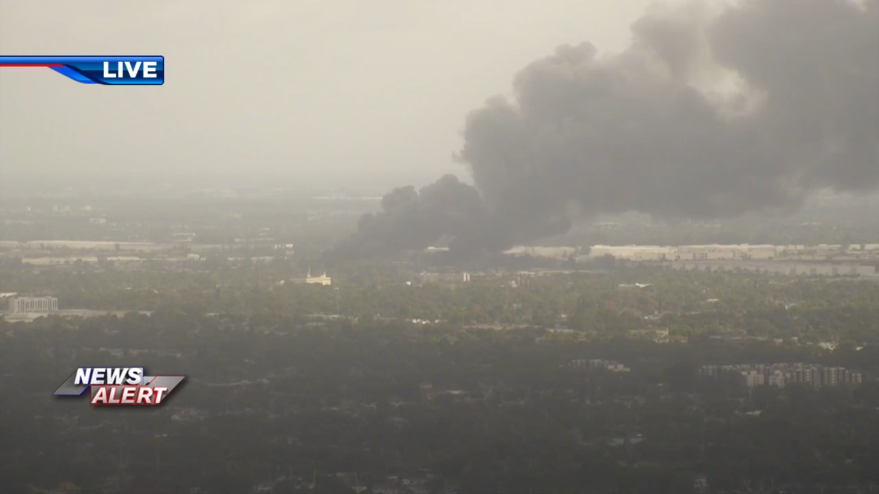 Plumes of smoke billow across Opa-locka during junkyard fire