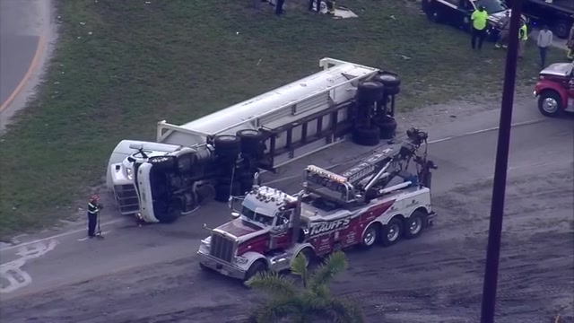 Tractor-trailer rollover wreck in Miami Gardens causes lane closures on NW 7th Ave. Extension; no injuries