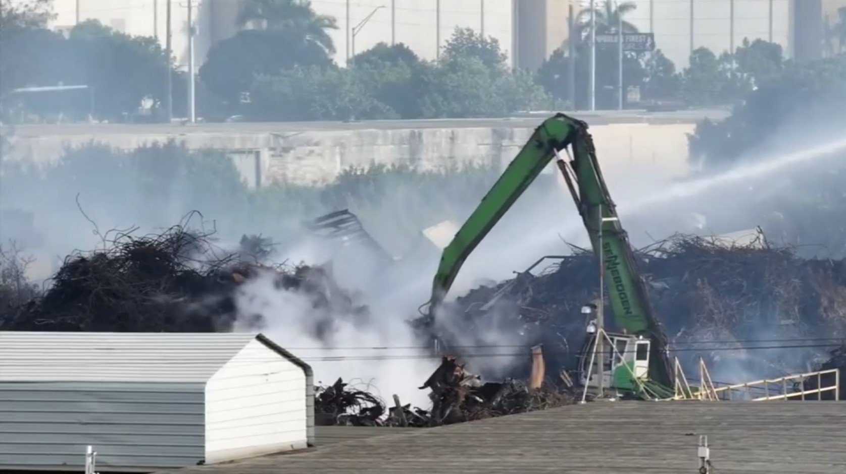 NW 135th St. reopens in Opa-Locka as crews contain massive junkyard fire