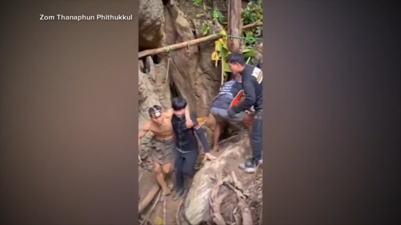 Rescuers search for alternative route to reach 2 missing in a flooded Laos cave