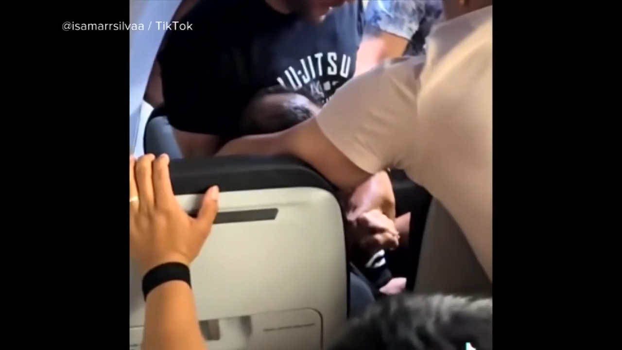 Unruly passenger arrested at MIA after trying to pry open exit doors, choking off-duty flight attendant, police say