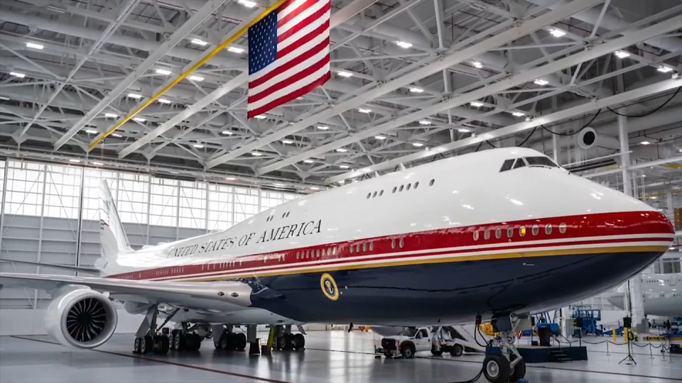 President Donald Trump unveils the new Air Force One, a converted Qatari jet
