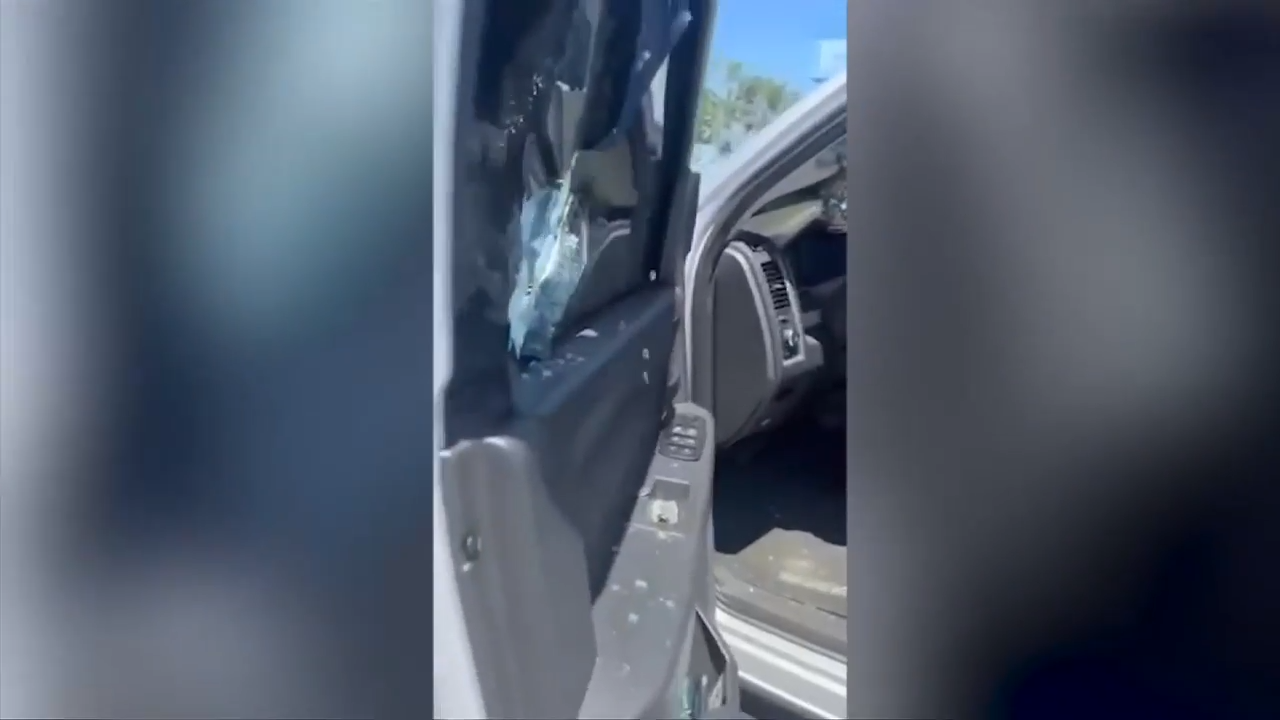 Father punches through car window after young son accidentally locked siblings inside