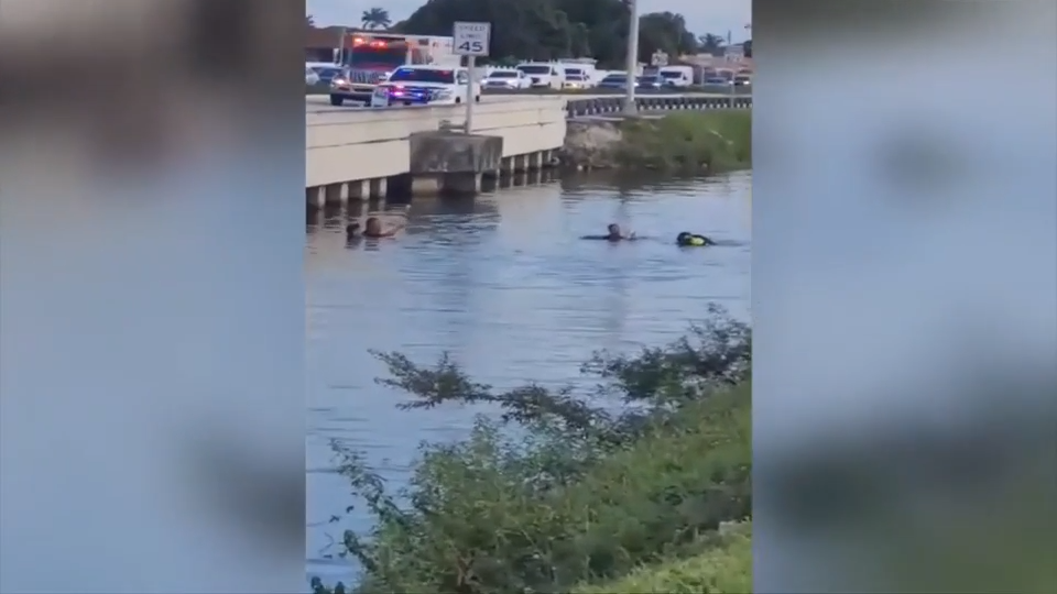 1 airlifted after Tesla crashes into canal in Hialeah; cellphone video shows divers rescuing victims