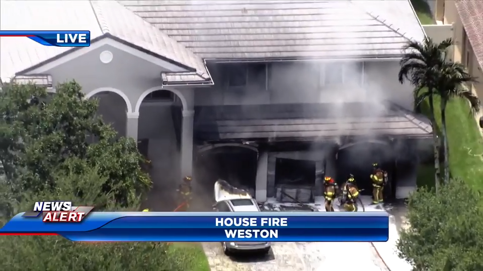 2 people OK after cars inside Weston home garage erupt in flames