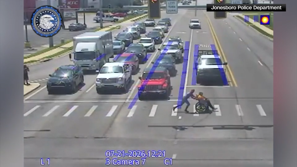 Spider-Man Impersonator Helps Person in Wheelchair Across Busy Street
