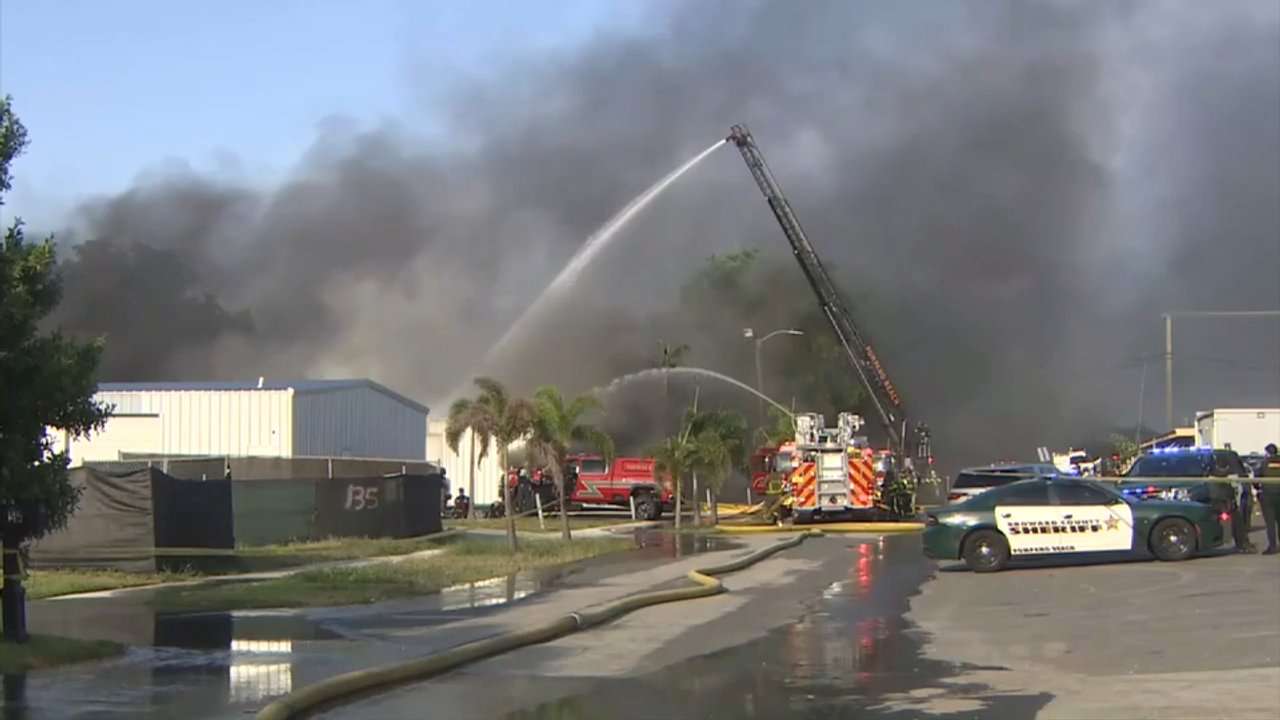 Fire crews battle massive warehouse blaze in Pompano Beach neighborhood