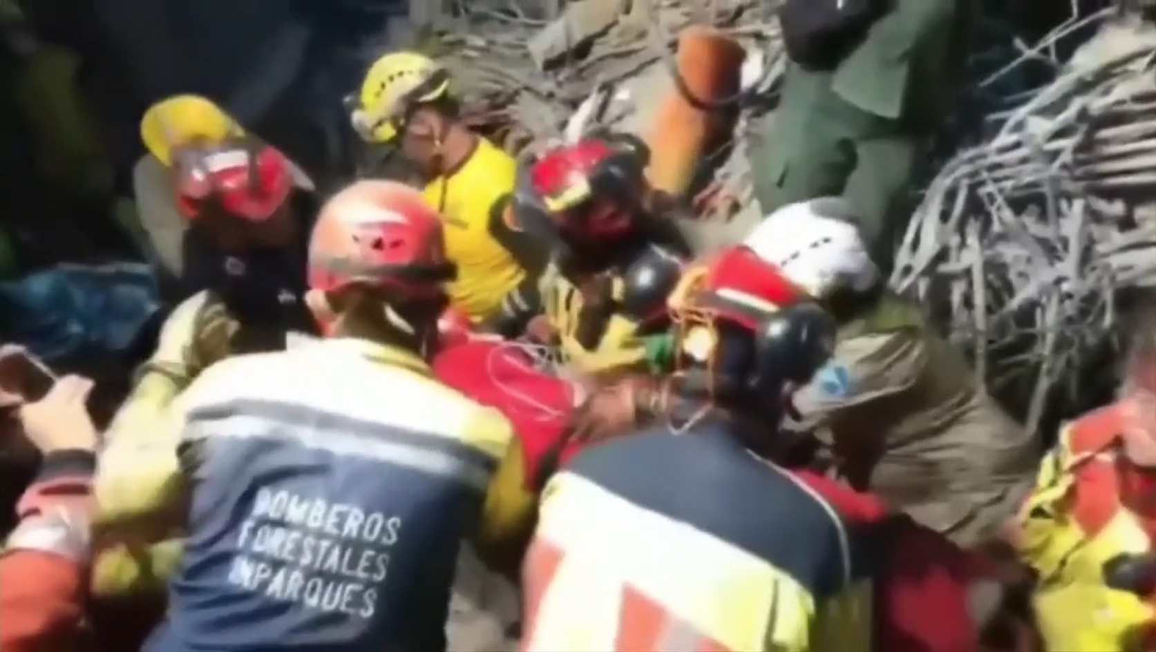 Venezuelan security guard pulled alive from building basement 8 days after twin quakes