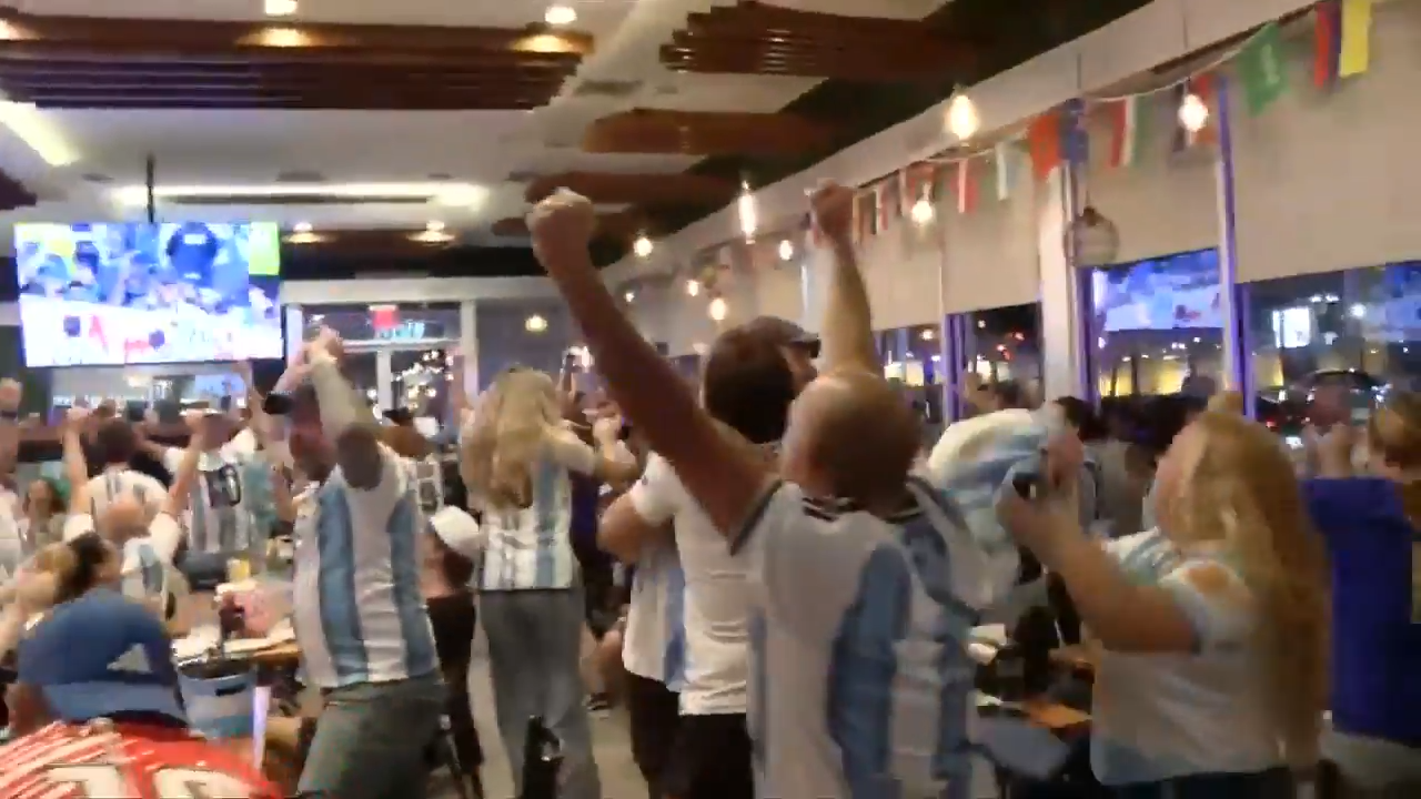 Argentina fans at Manolo in Miami Beach celebrate World Cup victory against Switzerland, as Argentina moves to semifinals