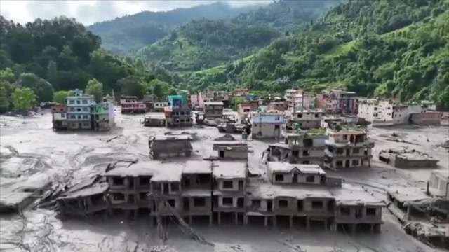 Death toll rises in Nepal-China border disaster as a lake poses new flood threat
