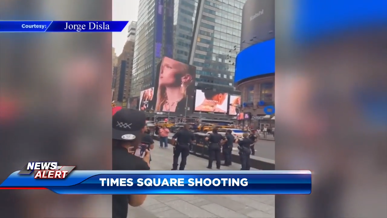 A woman brandishing two knives is shot by police in Times Square