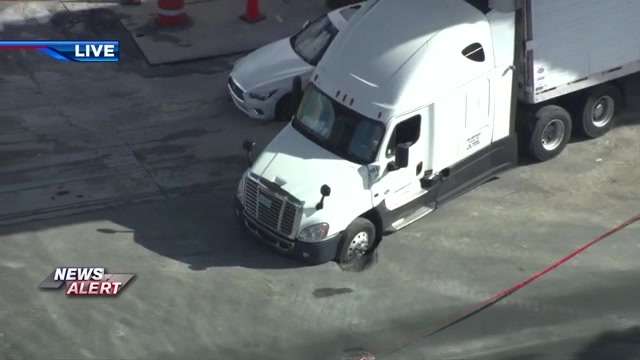 Small sinkhole opens up beneath semi-truck in NW Miami-Dade, shutting down NW 79th St between 27th and 32nd Ave - WSVN 7News | Miami News, Weather, Sports | Fort Lauderdale