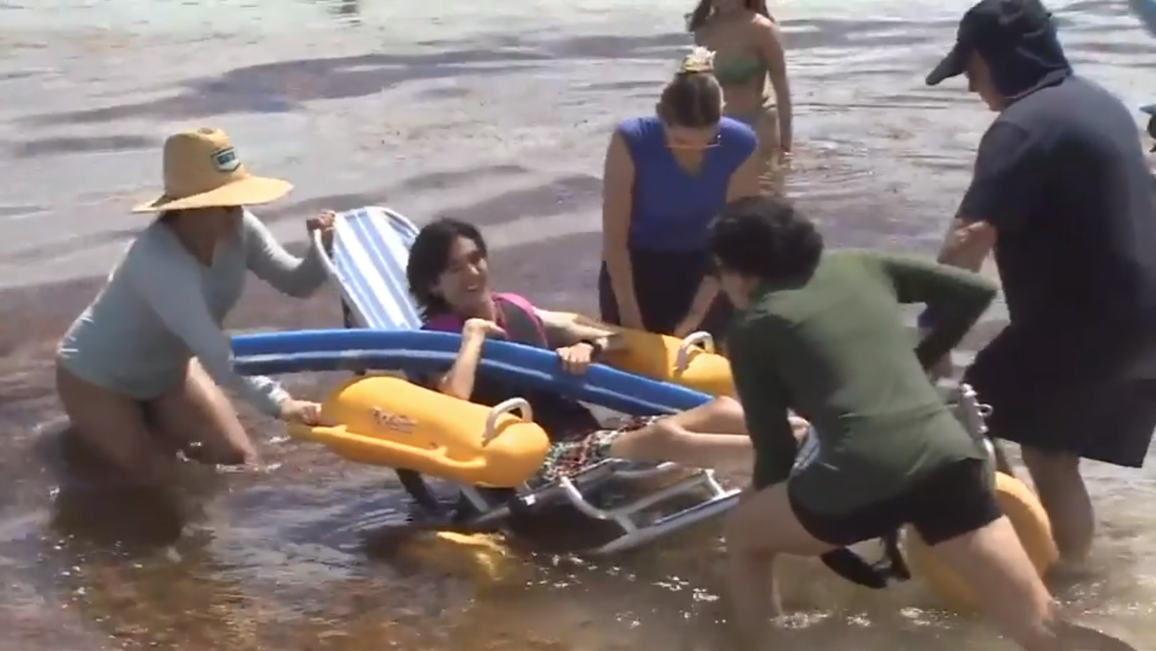 People with disabilities enjoy sand and surf during Sabrina Cohen Adaptive Beach Day