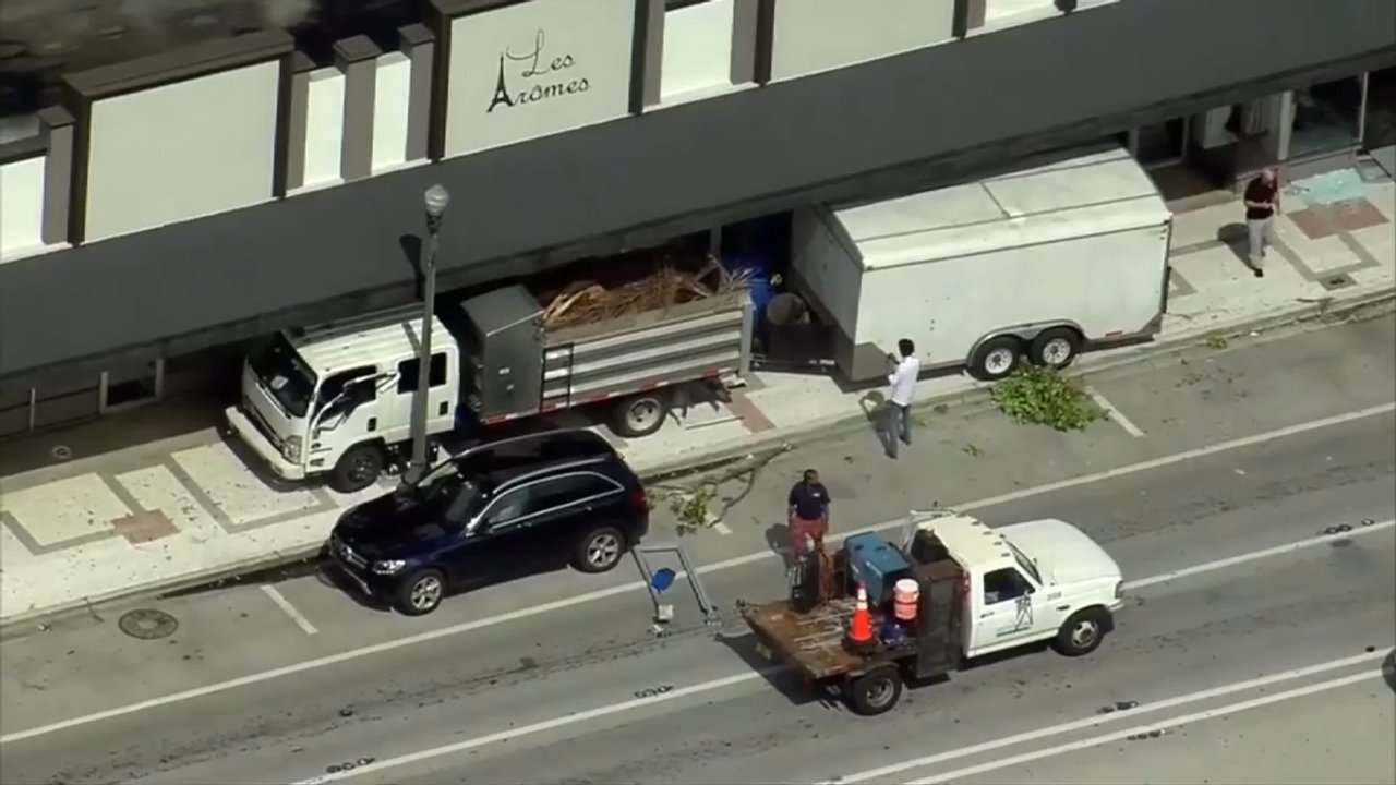 Landscaping truck crashes through bus stop, storefront in North Miami; no injuries reported